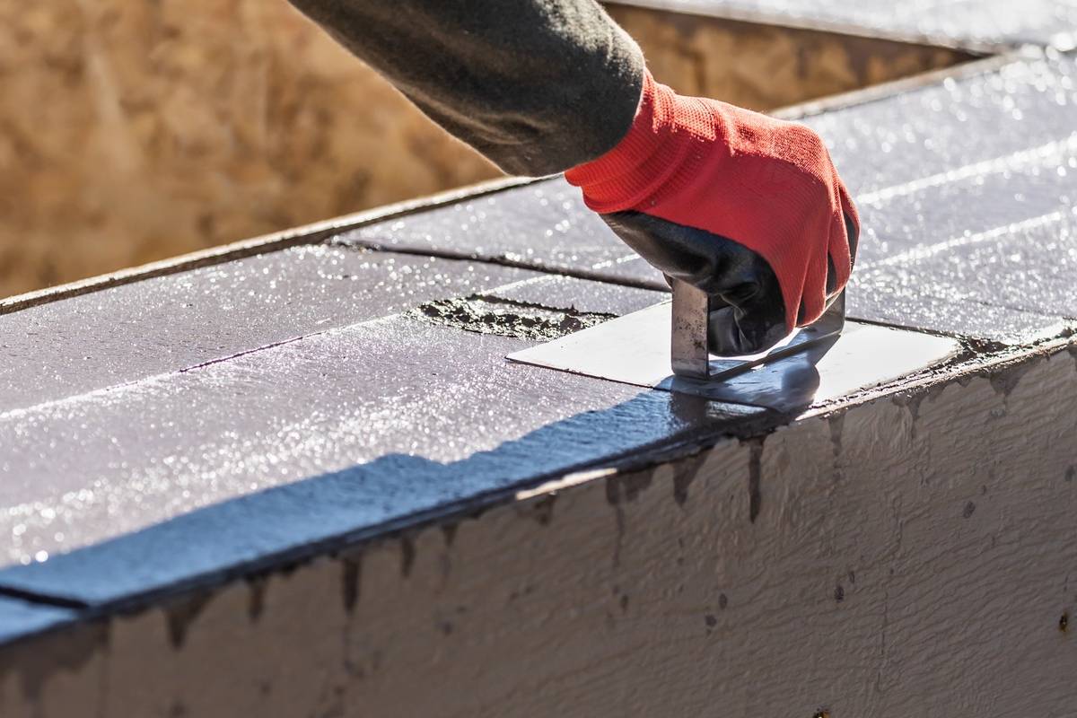 Concrete Contractors Tulsa OK 34081860 Construction Worker Using Hand Groover On Wet Cement Forming Cop